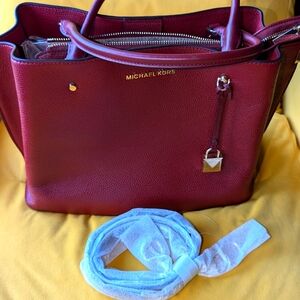 Michael Kors Burgundy medium size satchel hand bag with shoulder strap